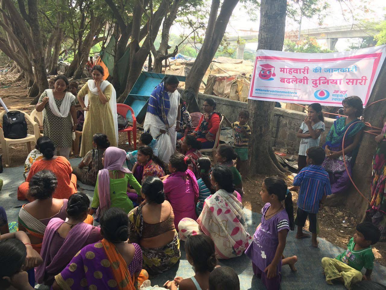 Diverse group of people discussing menstrual health openly